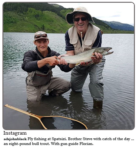 Fly Fishing at Spatsizi. Brother Steve with catch of the day....an eight-pound bull trout. With gun guid Florian.